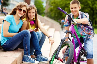 smiling kids on steps