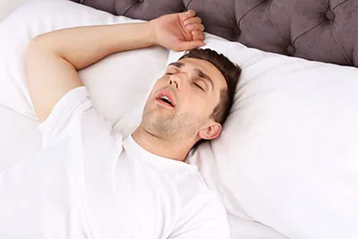 man sleeping with mouth open
